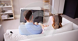 Man Sitting On Sofa In Front Fallen Television
