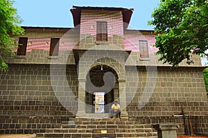Man sitting on steps, exterior of Vitthal Mandir, Vithalwadi wadi, Prati Pandharpur