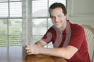 Man sitting at table.