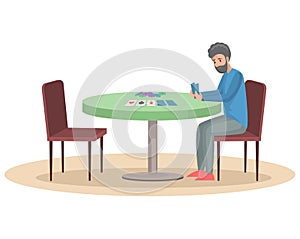 Man sitting at table and playing with cards. Male character spends time with poker game, gambling