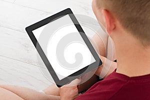 Man sitting with tablet in hands.Top view.Mock up.Copy space.Template.Blank. photo