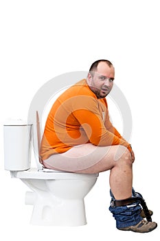 Man sitting on toilet photo