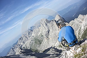 Man sitting on top of the mountain