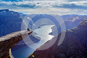 Man sitting on trolltunga in norway