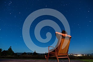 Man sitting under the stars
