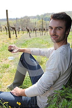 Man sitting in a vineyard