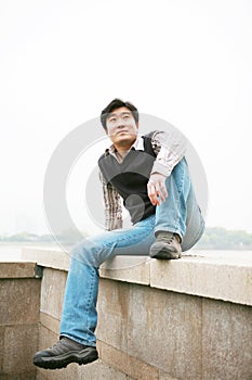 Man sitting on wall