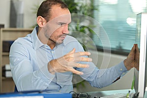 Man sitting and working at desk