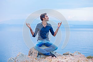 Man sitting in yoga meditation pose