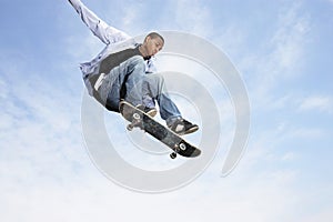 Man On Skateboard In Midair photo