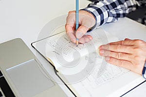 Man sketching graphic design for website