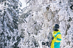 man in ski equipment with snowboard