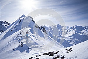 Man on ski tour in the mountains at peak of Kraxentrager in HochfÃ¼gen, Zillertal Austria