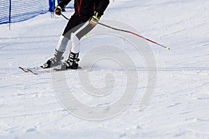 Man skier riding down the slope