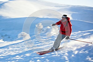 Man skier running down the hill