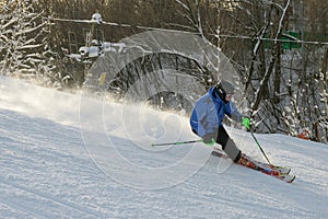 A man skiing down ski slope