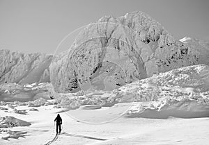 Man skiing on fresh powder snow.