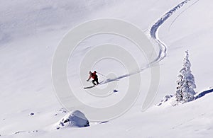 Man skiing on fresh powder snow.