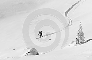 Man skiing on fresh powder snow.