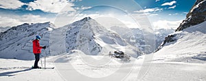 Man skiing on the prepared slope with fresh new powder snow in A