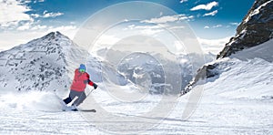 Man skiing on the prepared slope with fresh new powder snow in A