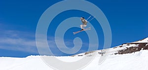Man skiing on slopes of Pradollano ski resort in Spain photo