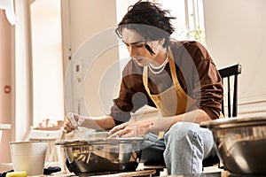 Handsome stylish man creating pottery in