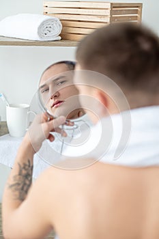 man skincare acne problem zit mirror reflection photo