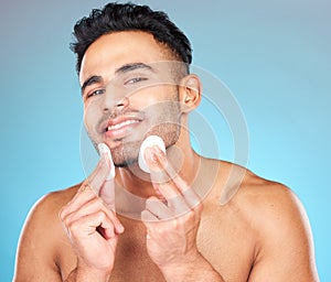 Man, skincare portrait and cotton pad in studio for beauty, wellness or cosmetic self care with smile. Happy, model face