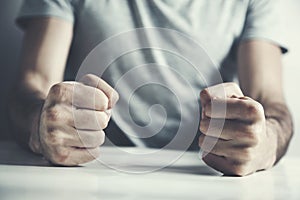 Man slamming her fist on a  table photo