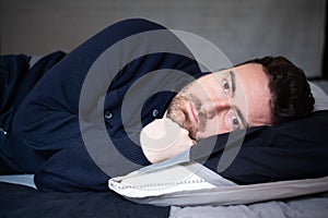 Man with sleep disorder lying in the bed
