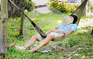 man sleep in a hammock