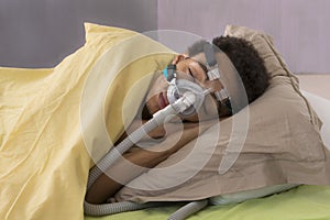 Man with sleeping apnea and CPAP machine