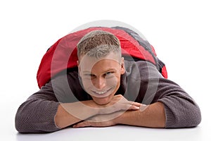 Man in sleeping bag lying