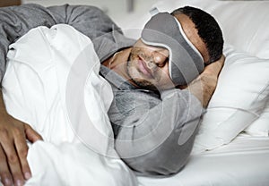 A man sleeping on a bed photo