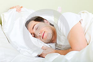 Man sleeping in bed