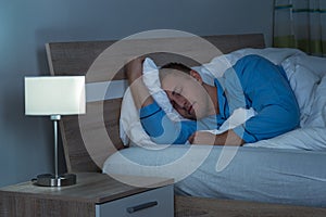 Man Sleeping In Bedroom