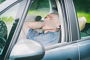 Man sleeping in the car