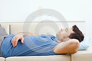 Man sleeping on couch