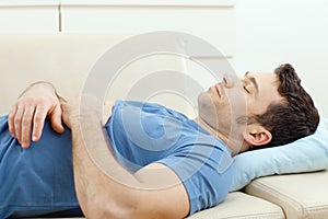 Man sleeping on couch photo