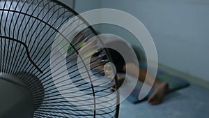 Man Sleeping With A Fan Blowing