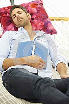 Man Sleeping In Garden Hammock