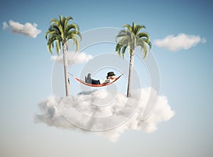 Man sleeping on hammock between two palm trees in the clouds