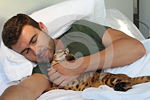 Man sleeping with his cat