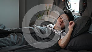Man sleeping in his comfortable bed after tiring day. photo