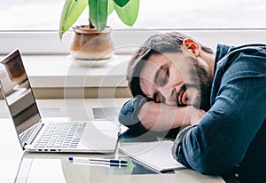 Man sleeping with his laptop