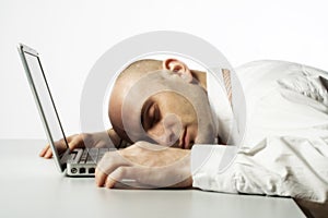 Man sleeping on laptop computer