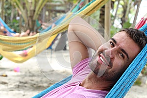 Man sleeping in large hammock area