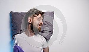 Man sleeping on side with smile