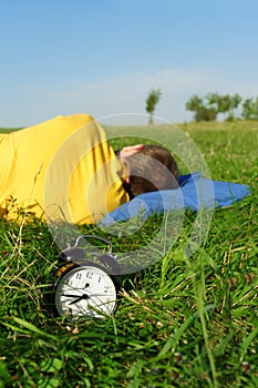 Man sleeping on summer lawn